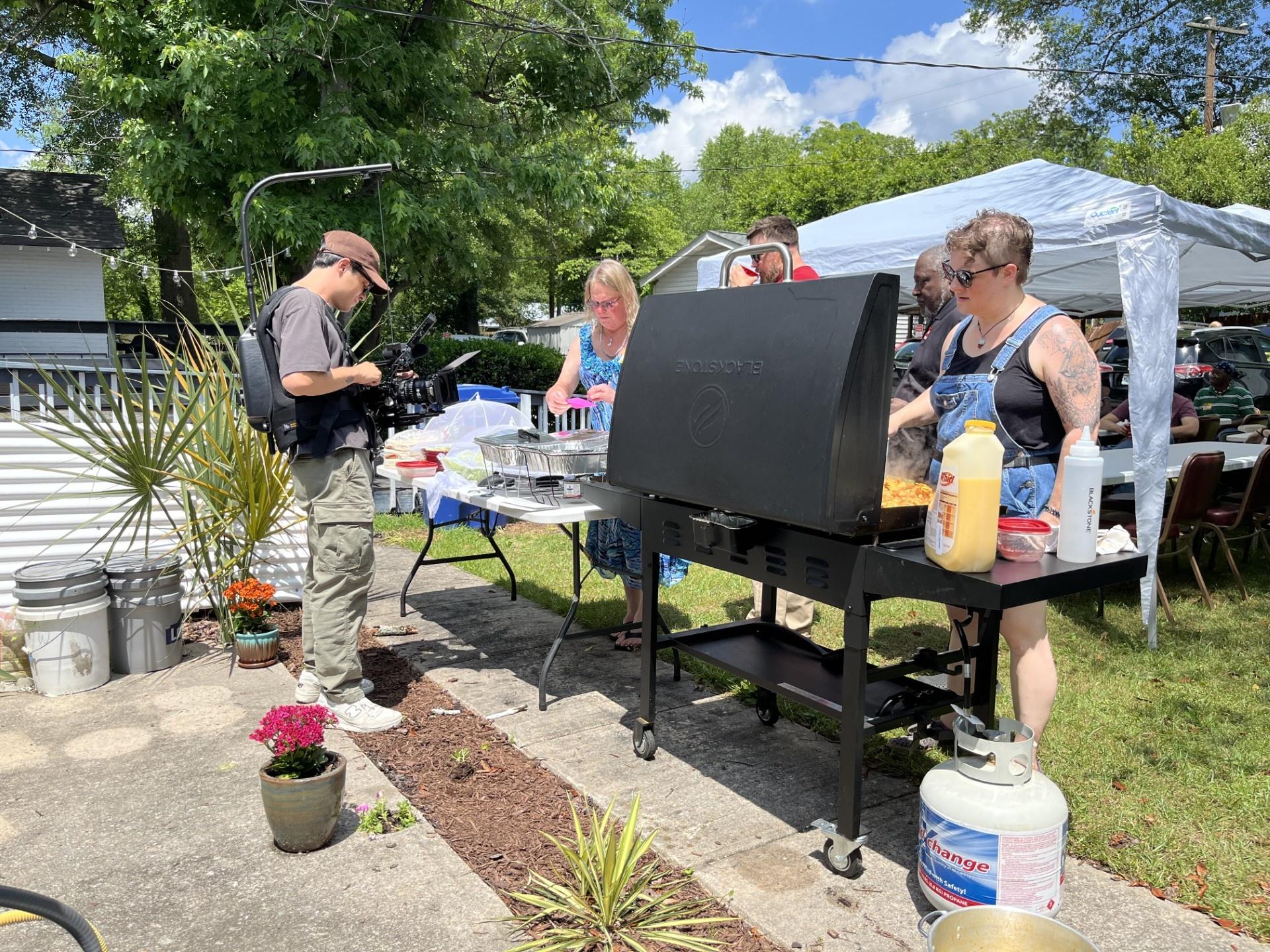 Dries Vandenberg, cinematographer, capturing a LGBTQIA+ potluck.