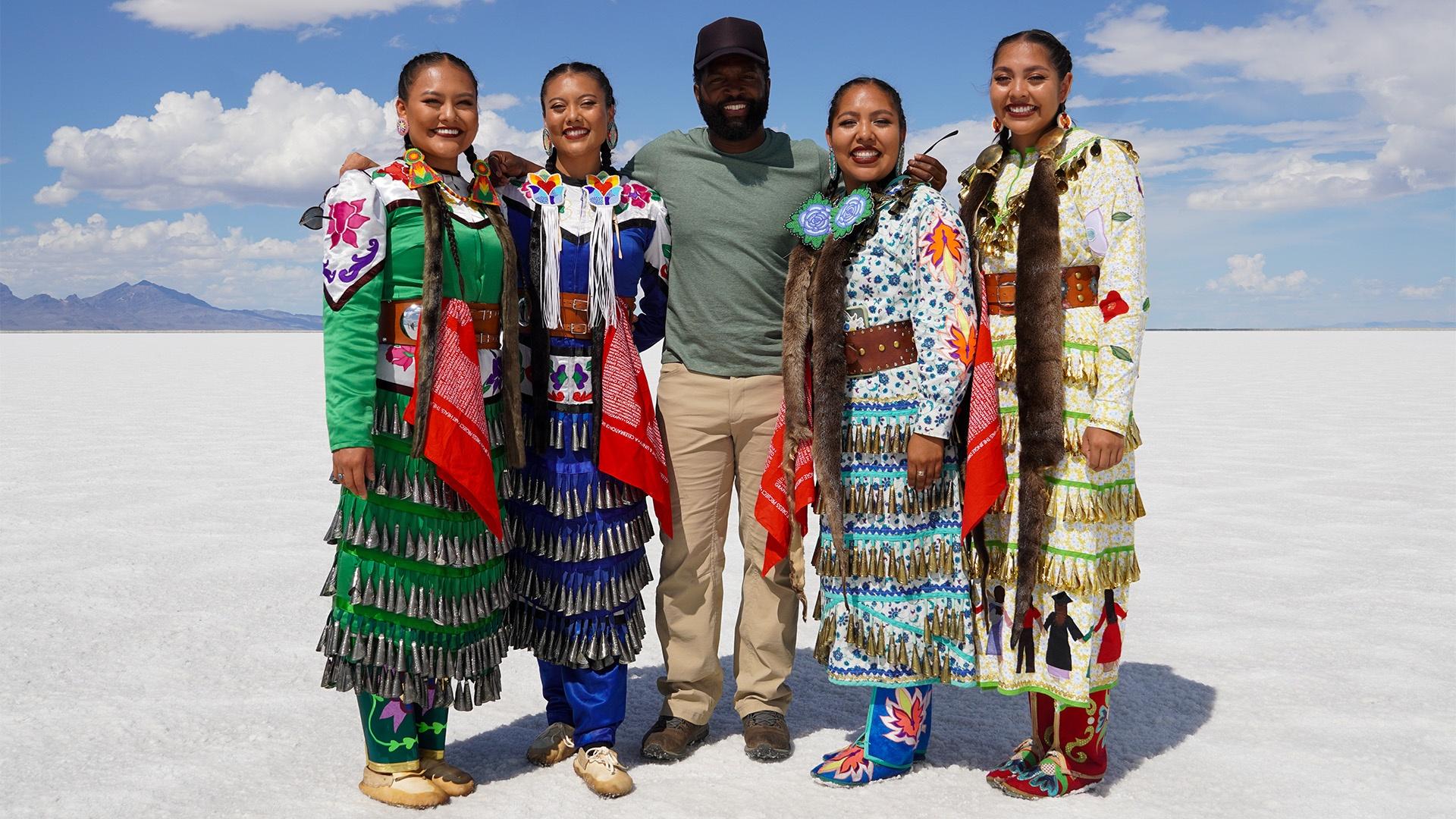 Five people standing on salt flats