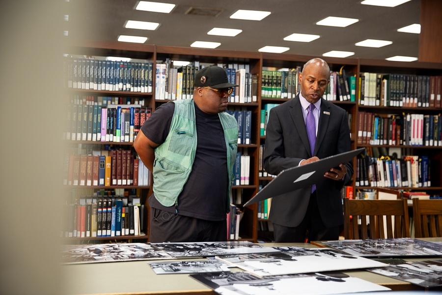 KJ Kearney and Dr. Donaldson looking over archival activism photos.