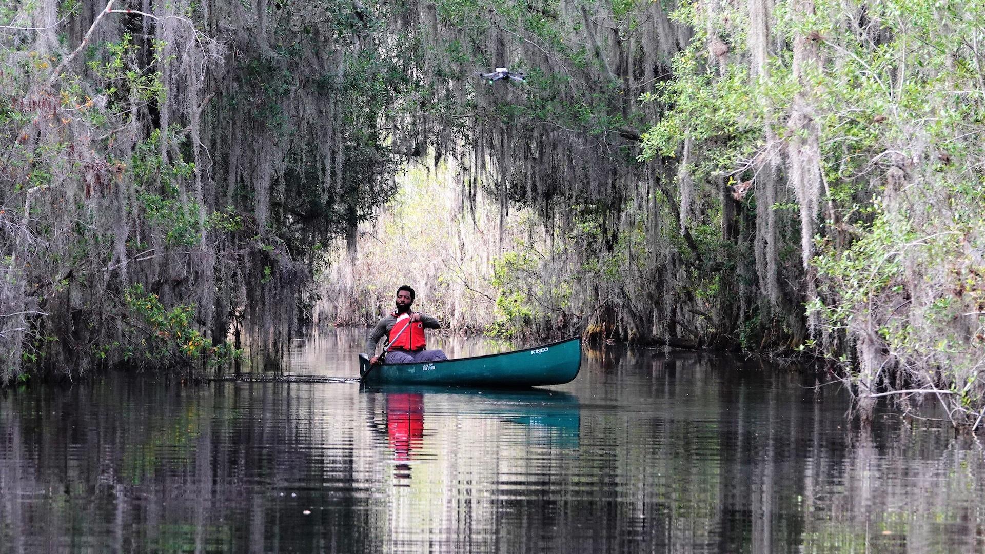 Baratunde sitting in a canoe on the Suwannee River